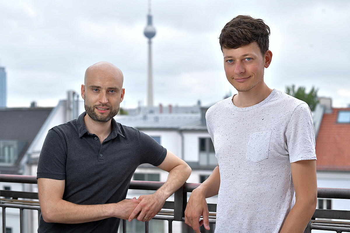 alcemy founders Leopold Spenner and Dr. Robert Meyer with the Alexanderplatz TV tower in the background.